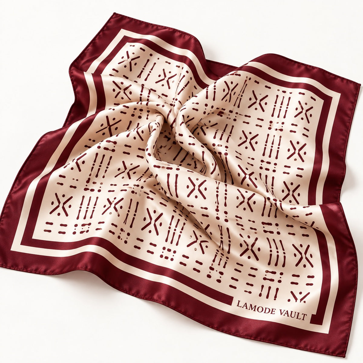 Burgundy and cream Adire-inspired silk satin scarf softly draped