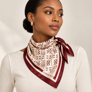 Woman wearing burgundy Lamode Vault silk square scarf around her neck