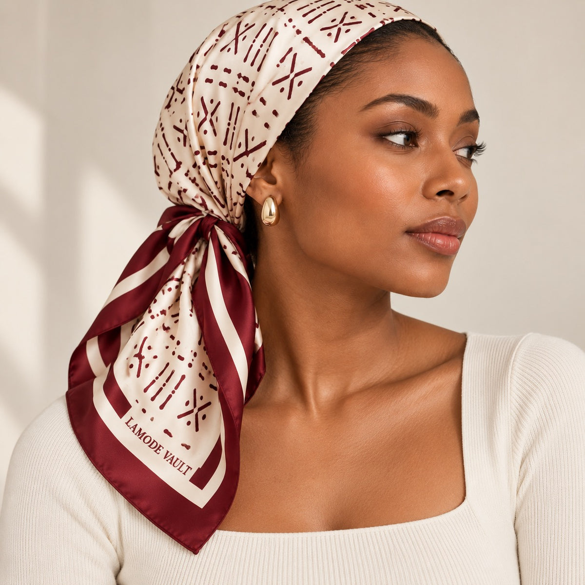 Woman wearing burgundy and cream silk scarf as a headscarf