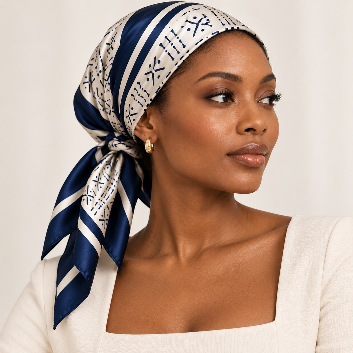 Woman wearing Midnight Navy and cream silk square scarf as a headscarf