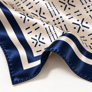 Close-up of Midnight Navy Adire-inspired silk scarf with hand-rolled edge