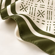 Close-up of Midnight Navy Adire-inspired silk scarf with hand-rolled edge