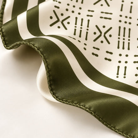 Close-up of Midnight Navy Adire-inspired silk scarf with hand-rolled edge